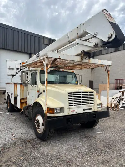2001 International service/bucket truck. Equipped with a Hi-Ranger aerial boom and full utility body...