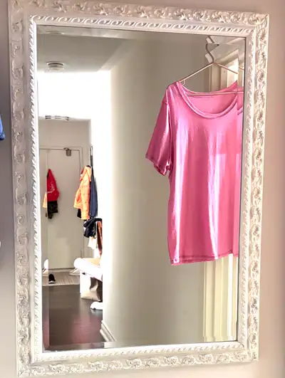 large beveled mirror with wooden trim detailed, View more