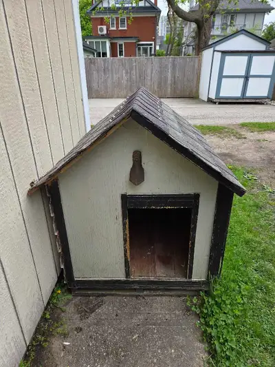 O.B.O. Insulated dog house. Built like a real house by a carpenter, siding, shigles, wood laminate f...