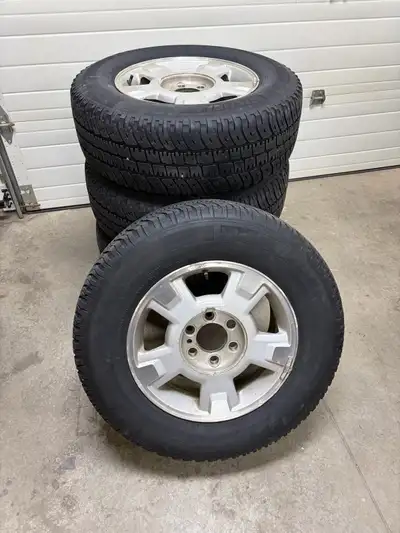 I am selling a set of four 2010-2014 factory aluminum wheels with Michelin LTX A/T tires, size P245/...