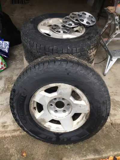 As New ONLY 1500 kms 4 tires Laufenn “AT” X-Fit Off of Chevy Silverado Rims and caps- ready to bolt...
