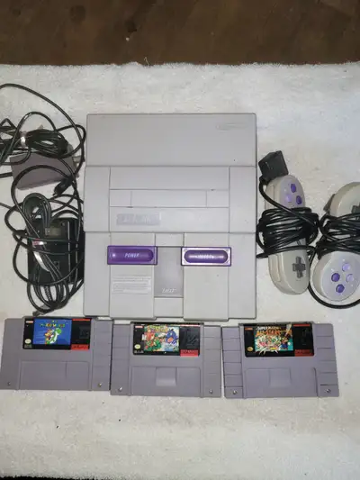 Super nintendo system and cords 2 controllers 3 games Super mario world Mario all-stars Super mario...