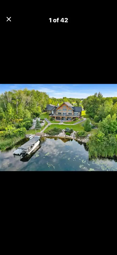 Discover this magnificent, custom-built timberframe home situated on a stunning waterfront lot in Ma...