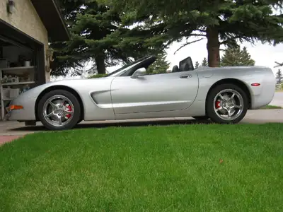 It's a silver 2003 C5 Corvette convertible with an LS1 V8, a 6-speed manual transmission, magnetic s...