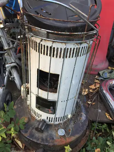 Kerosine heater for $20. Location - WAY out in south of yard sale near the blue pick up truck PLEASE...