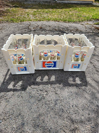 Vintage Pepsi Cola bottles with crates