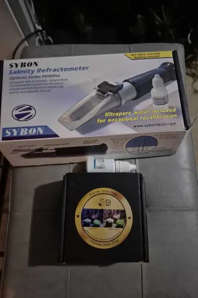 Sybon salinity refractometer in hard plastic case with attachments, and marine coral filter with 3 l...