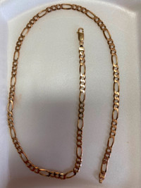 Gold figaro chain