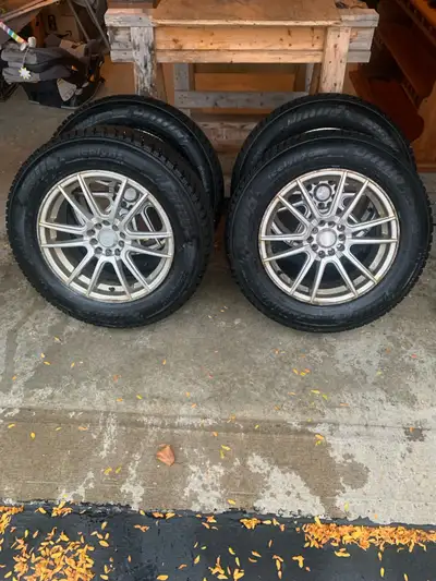 I'm selling a set of four used 225/65/R17 Trangle Icelynx winter tires mounted on Akita Racing alumi...