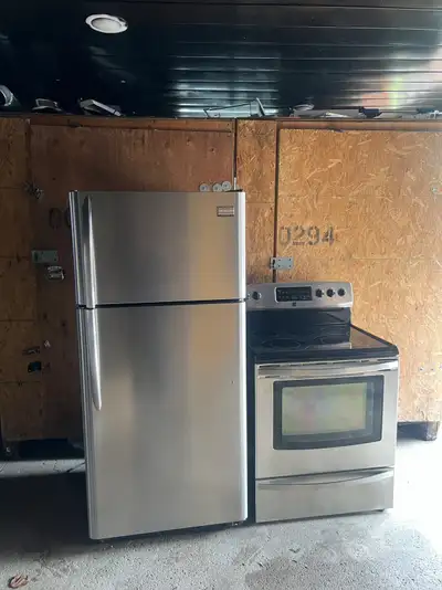 Like new stainless steel fridge and glass top stove set , View more
