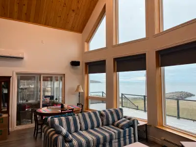 Location is 200 ft from the water with ocean views from many windows including access to a massive d...
