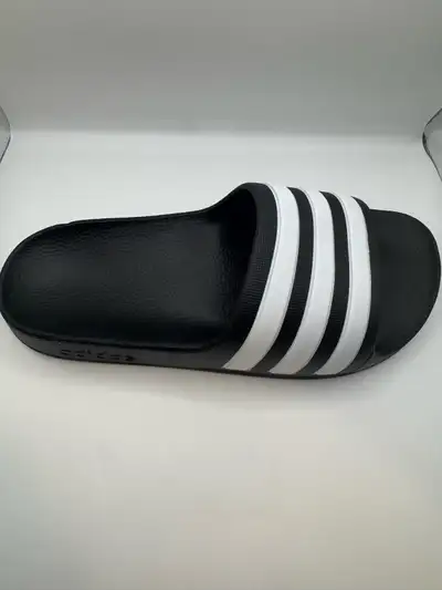 Get ready for summer with these brand new Adidas slides, perfect for the beach, pool, or just loungi...
