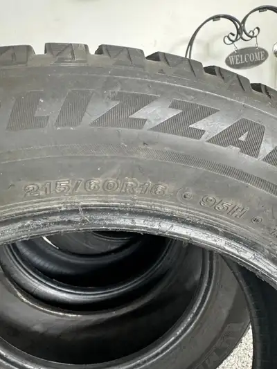 Selling a set of used Blizzak winter tires, size 215/60R16, perfect for providing excellent grip and...