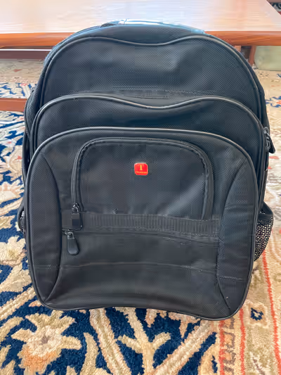 Tracker black knapsack $25 Black multi pocket soft knapsack. 1 large main pockets and 3 additional s...