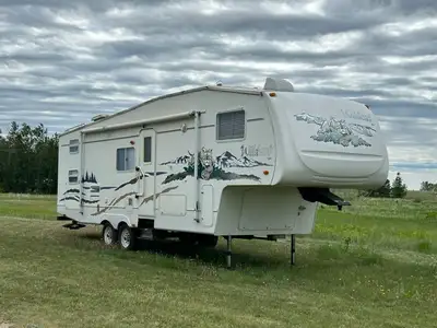 Excellent used condition. New rubber roof and air conditioner in 2023. Queen bed in front. Jack and...