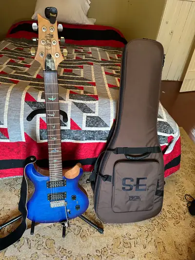 PRS 35th Anniversary 6 string electric guitar with gig bag, fender tuner, fender patch cord and stan...