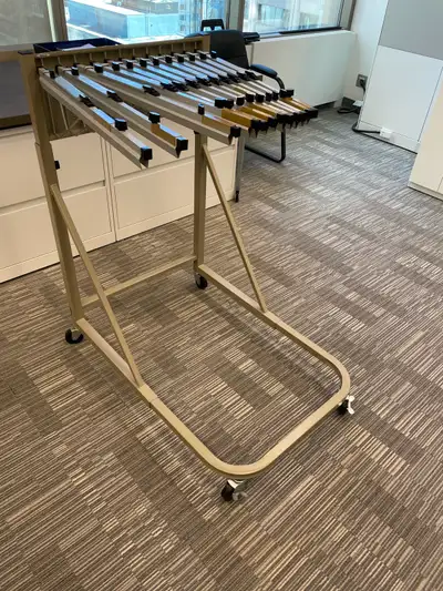 Rolling drawing rack has 12 hangars that clamp onto a drawing or any large page, up to 24”x38” in si...