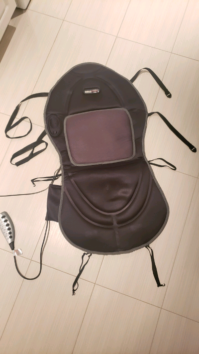 An Obus Forme heated massage seat cushion with controller. Versatile power connector allows plug in...