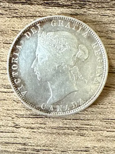 HIGHER GRADE STERLING SILVER 25 CENT COIN. PRICE IS FIRM