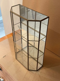 Small glass wall curio cabinet 