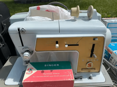 This is a Singer Touch & Sew Model 603 sewing machine. It is a used item, but in good working condit...