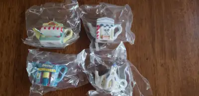 Here are four different vintage Red Rose mini ceramic teapots sealed in the package....excellent con...