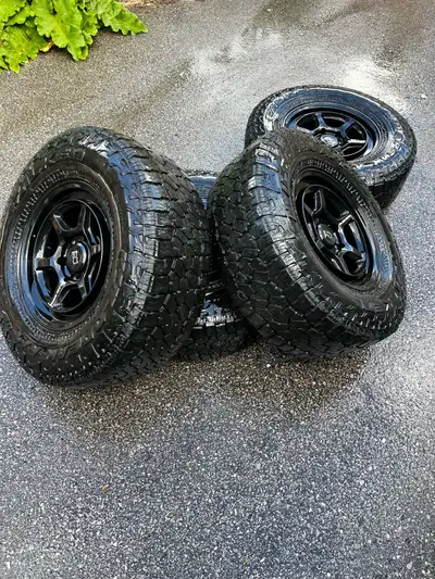Falken wild peck A/T 4w On Black rhinos In amazing shape zero issues at all. Balanced with TPMS sens...