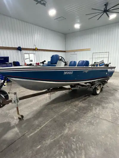 16’ Lund fishing boat with 70hp Evinrude. Comes with hummingbird fish finder. Floor and 4 swivel sea...