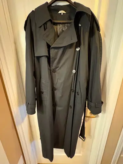 Men's size 40 double breasted black overcoat. Has a zip out liner for four season use. In very good...