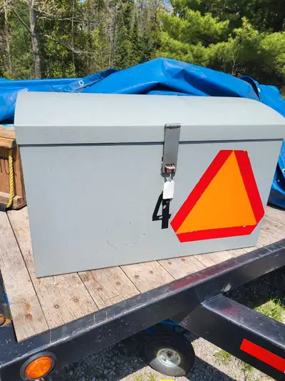 Metal humpback storage chest. Has happened for lock. Could be mounted on a trailer or back of ATV or...