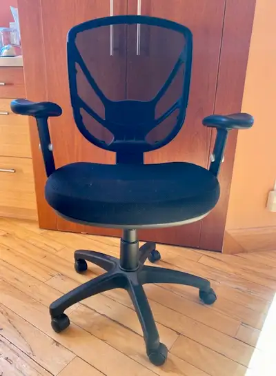 This is a mesh/fabric task/office chair that has been used in a smoke-free home. It is about ten yea...