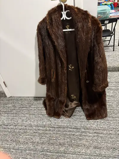 woman’s fur coat, View more