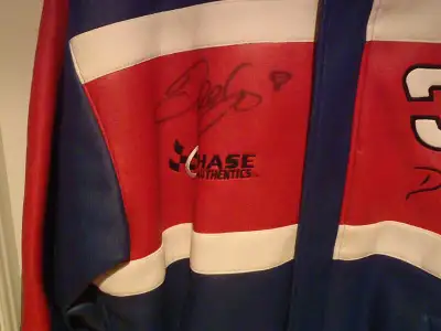 Dale Earnhardt Jr Used i have pictures of Dale Jr signing the jacket with the young person wearing i...