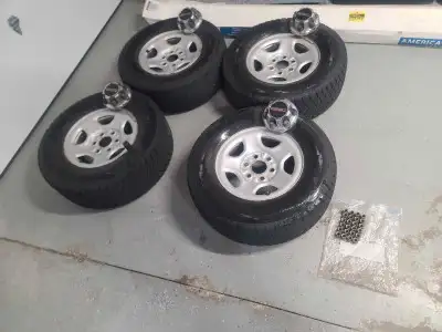 Bridgestone Blizzak dm-v2 255/70R16 $700 with rims and GMC centre caps and lug nuts fits 6 lug sierr...