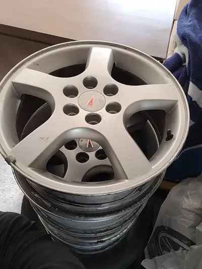 Have a set of 4 GM/Chevy/Pontiac 17" Rims (no tires). Set 1. Nice set of 6 bolt rims with the Pontia...