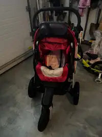 Jogging stroller with ride along step 