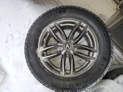 I'm selling a set of four Acura rims with winter tires, sized 245/65R17. These tires are mounted on...