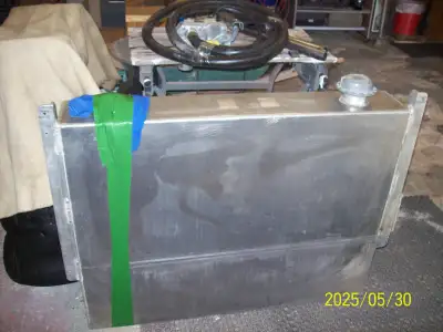 36 US gal aluminum diesel fuel tank c/w 12 volt pump, hose and nozzle. No longer needed for welding...