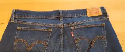 Size 31 men's Levi's red tab jeans. Sloght fray on one hem otherwise excellent condition. Smoke free...