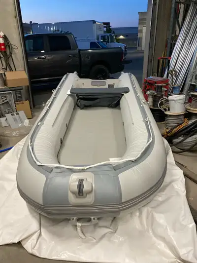 This is a 12-foot Seabright inflatable boat,complete with 50lbs minkota trolling motor battery and c...