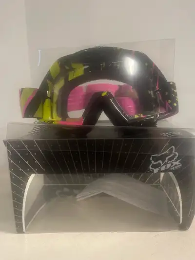 The Fox Motorcycle Goggles, used once, are in like-new condition. Featuring a vibrant pink and yello...