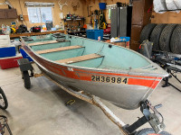 14 foot Lund fishing boat and Calkins trailer
