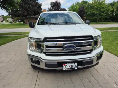 AC, power windows & locks, rear tailgate loader, tool boxes on both sides of box as well as in back...