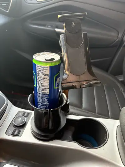 This is a used car cup holder phone mount for hands-free smartphone use, offering a secure and conve...