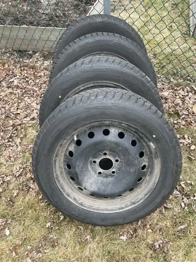 4 Blizzak snow tires size 235/55R18 100T mounted on rims with tire pressure sensors were used on a 2...