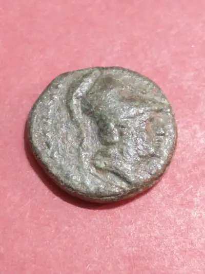 #2015-1251 in GB2. Obverse, helmeted Athena facing right. Reverse, Pan standing right, erecting trop...