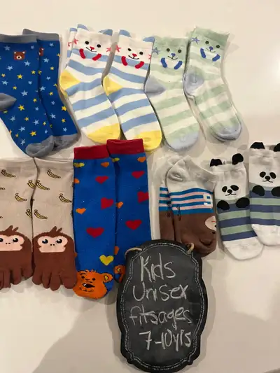 Lot of Cute kids unisex socks - fits ages 7-10 years Euc - top row many are brand new never worn Eve...