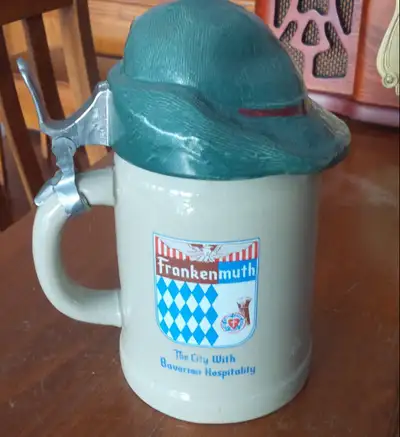 Stoneware stein, made in West Germany. Measures 8 inches tall and 12 inches in diameter. "Frankenmut...