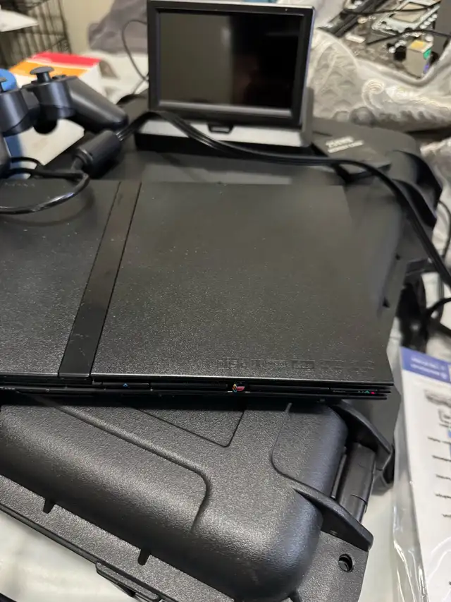 PlayStation 2 slim with games633475374698271211