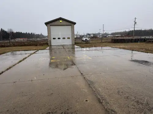 Commercial rental building, shop space. 3 offices. 1 Bath, large 16’x 16’ overhead garage door. Buil...